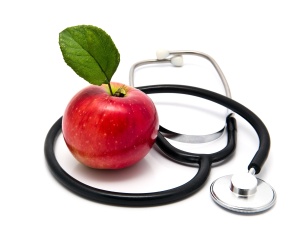 An image showing An apple and stethosope